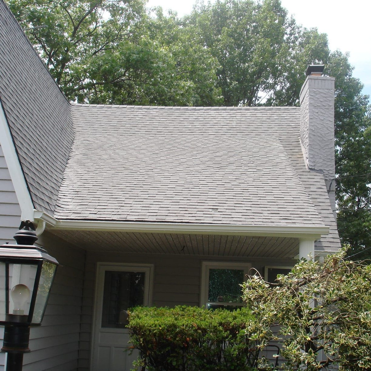 SoftWash Low Pressure Roof Cleaning Don’t replace your roof — restore it instead! Clean County provides professional roof cleaning services that protect the long life, curb appeal, and quality of your shingles. A Solution For Black Stains If you live in the Tri State area, it’s likely that you’ve run into the “black stain” issue on roofs. Many homes in the area have dark striped running down their shingles. The responsible party? A type of bacteria called Gloeocapsa Magma, which looks like algae and feeds on the limestone in your shingles. When Gloeocapsa Magma takes hold, it eats away at your roofing. This introduces issues like: